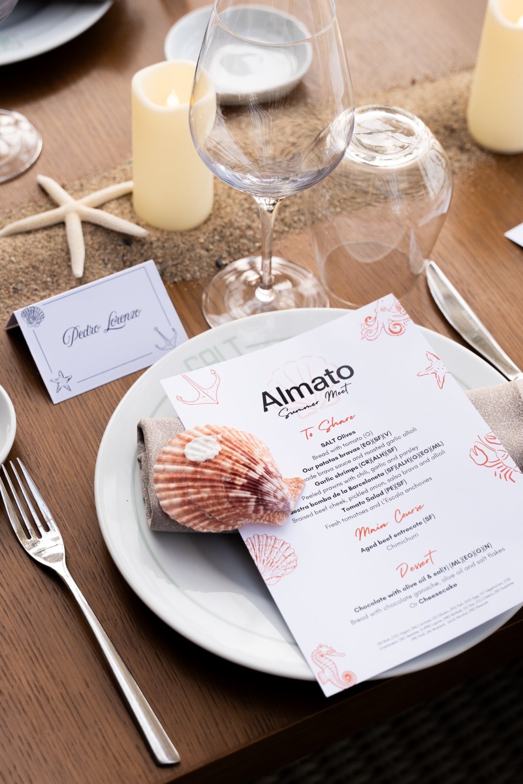 Coastal tablescape with shell place setting, calligraphed name card and printed menu at the Almato Summer Meet